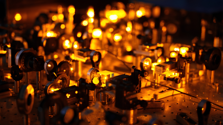 Quantum Computing with Neutral Atoms, Trapped Ions and Related Hybrid Systems